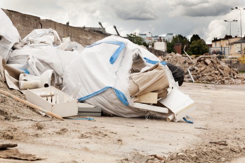 Construction site with clean waste clearance equipment in Peckham