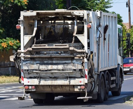 Electric low-carbon waste collection van in Peckham street